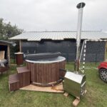 Fiberglass hot tub with external stainless steel heater and LED lighting