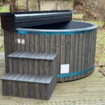 Fiberglass hot tub with external wood fired heater